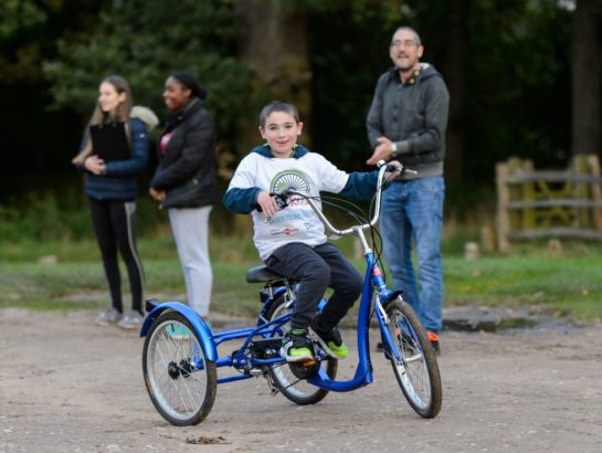 Child cycling on an inclusive Trike